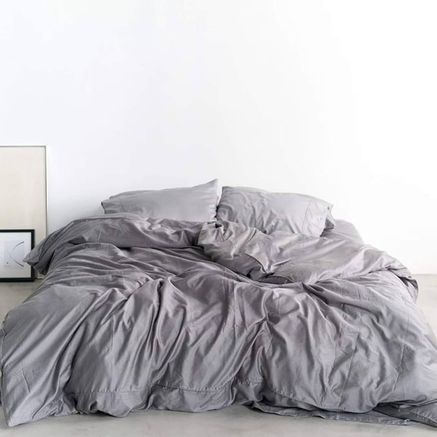 Miracle Sheets grey silver-infused bedding set on a bed